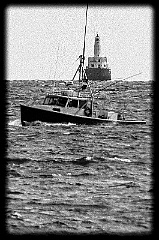 Fishing Boat Passes Cleveland Ledge Light - Gritty Look BW